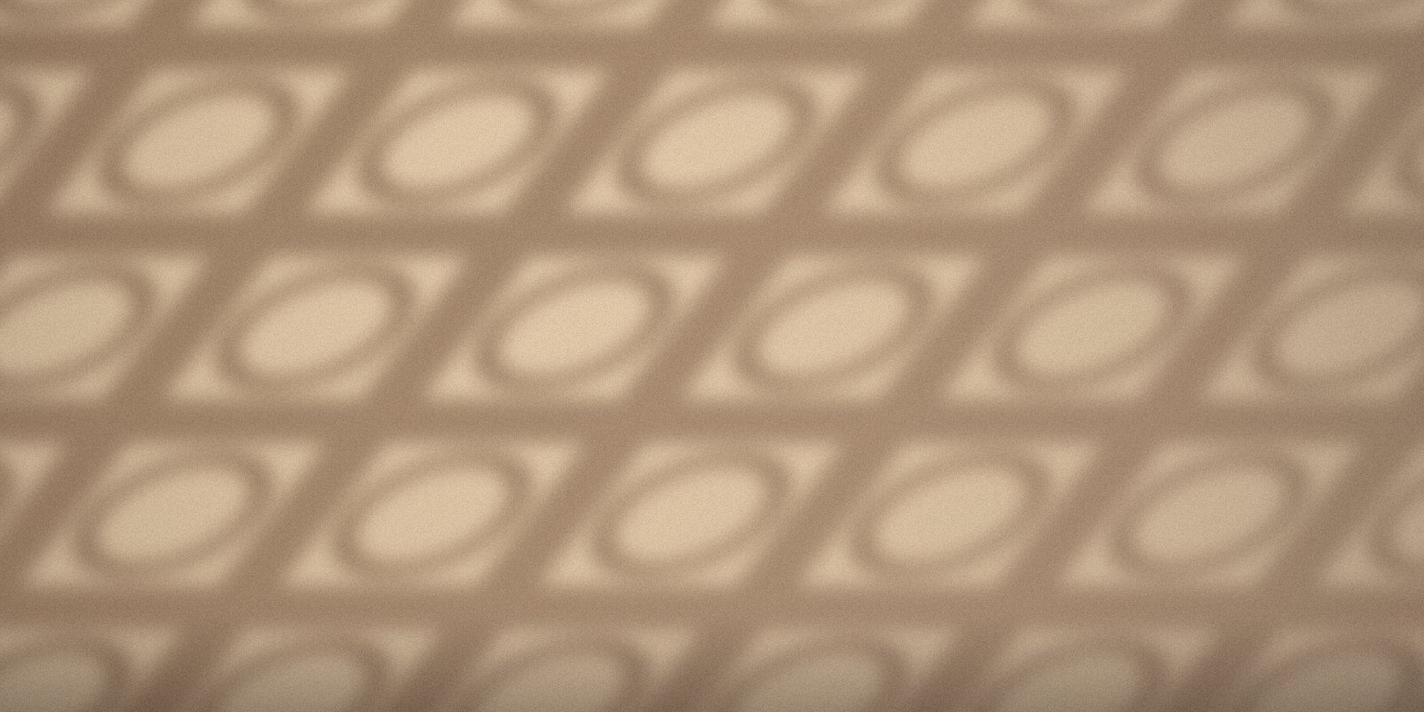 Afternoon light through a breeze-block screen on a west-facing wall.